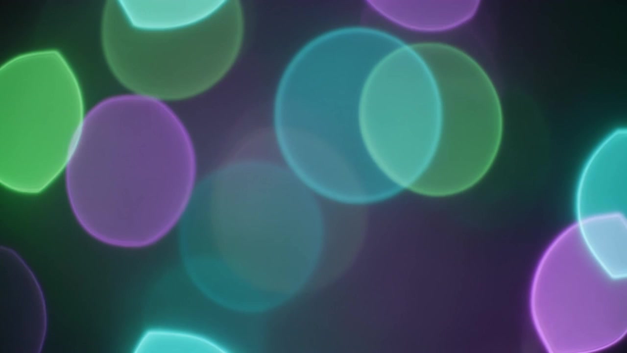 Abstracte achtergrond met gloeiende groene en paarse bokeh-cirkels