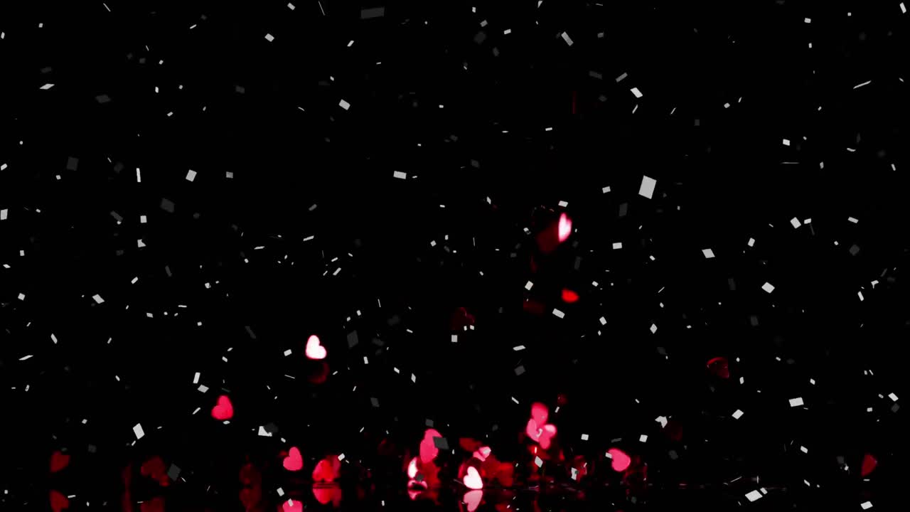 검은색 바탕에 빨간색 심장과 콘페티가 떨어지는 애니메이션