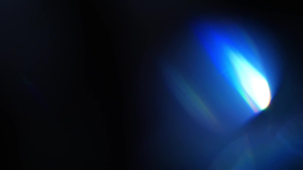 Dynamic Blue and Purple Light Leaks on Black Background
