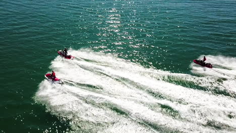 Intrepid-men-riding-water-scooters-at-high-speed-in-the-water