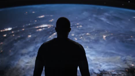 man looking at earth from space