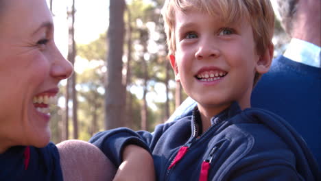 Happy-family-laughing-in-the-countryside,-close-up