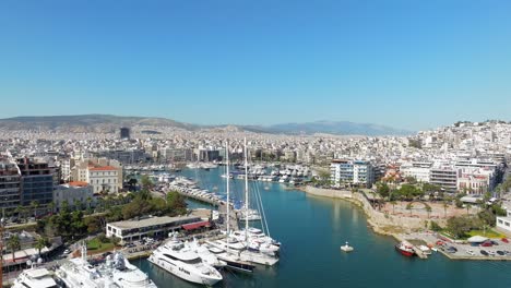 Flyover-luxurious-yachts-and-sailing-boats-toward-to-Marina-Zeas,-Piraeus