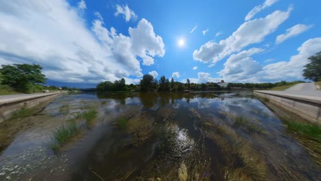 serene river landscape under a sunny sky