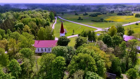 Aerial-View-Of-Skujene-Evangelical-Lutheran-Church-In-Cesis,-Latvia