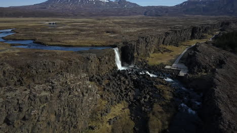 oxararfoss waterfall on a sunny day in thingvellir national park, iceland