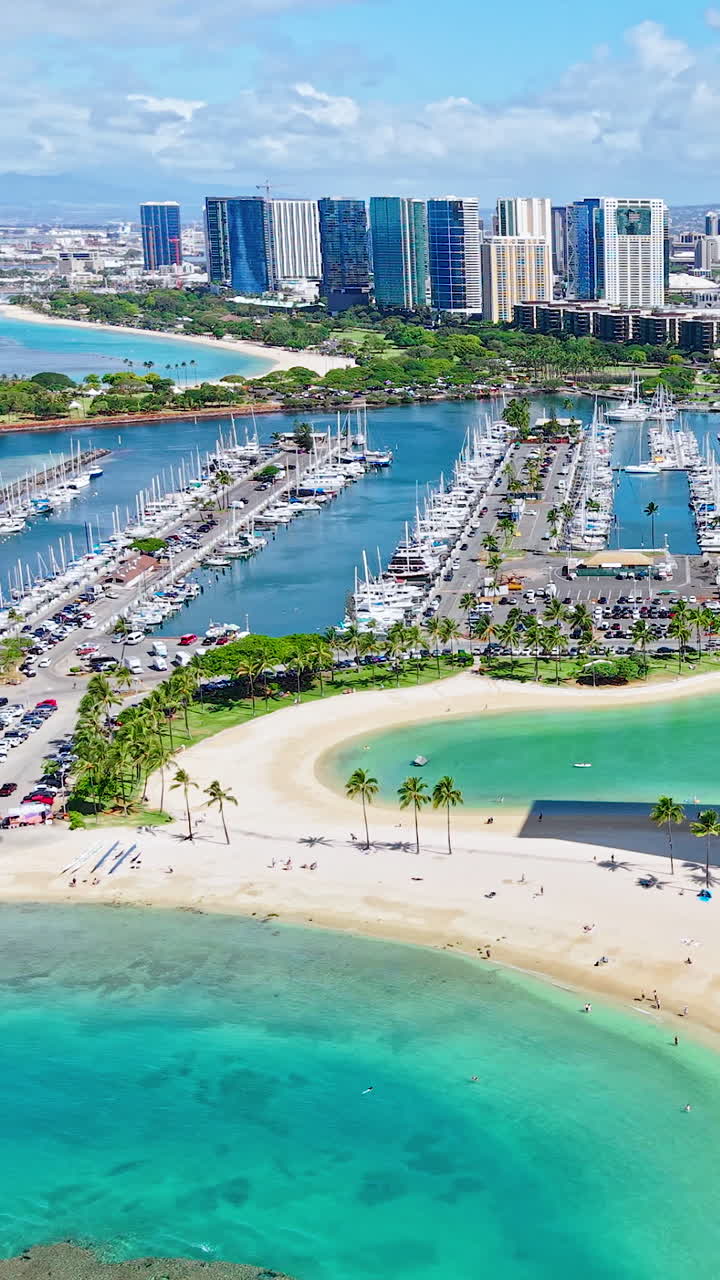Honolulu, Hawaii USA, Vertical Drone View of Beachfront Towers, Lagoon and Beach With Turquoise Ocean Water