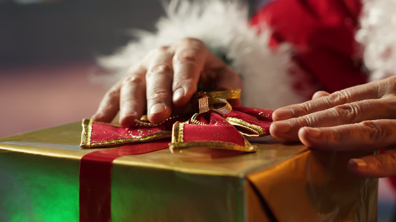 Santa Claus Wrapping Christmas Gift