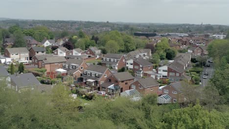 quiet british homes and gardens residential suburban property aerial view wide left orbit