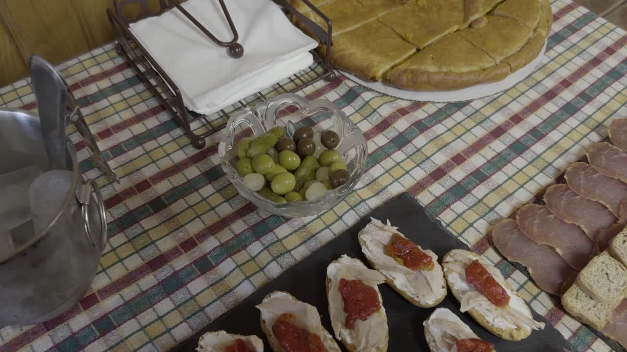 Delicious Tapas Displayed Over A Colourful Cloth With Ice Bucket And Drink