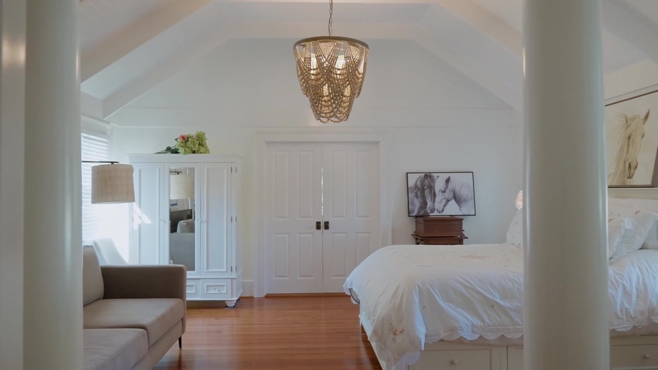 Entering the master bedroom of a luxury farm house