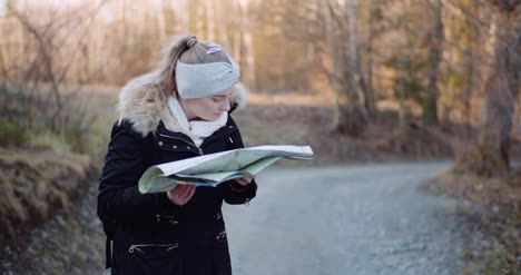 tourist reading map on trail in mountains 8