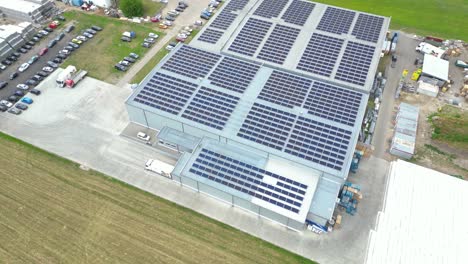aerial view of modern storage warehouse with solar panels on the roof