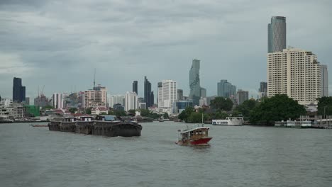 heavy industrial cargo freight transport industry shipping vessel on chao phraya bangkok waterway