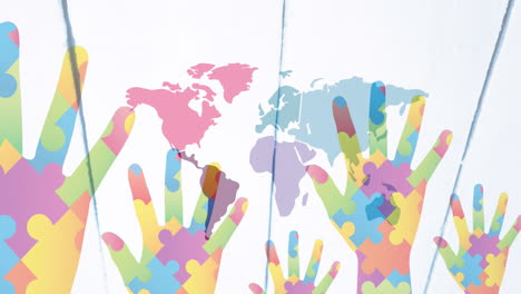 animation of hands with colourful puzzle pieces and world map