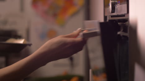 close up woman's arms adjusting oven temperature, open oven door and put tray in