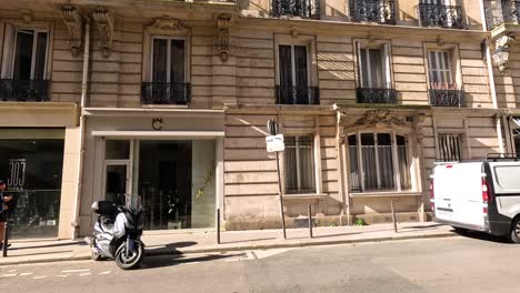 vehicles and pedestrians on a paris street