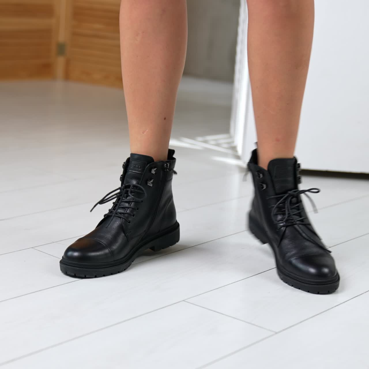 Boutique lifestyle posing in store. Rotating woman shoes showroom