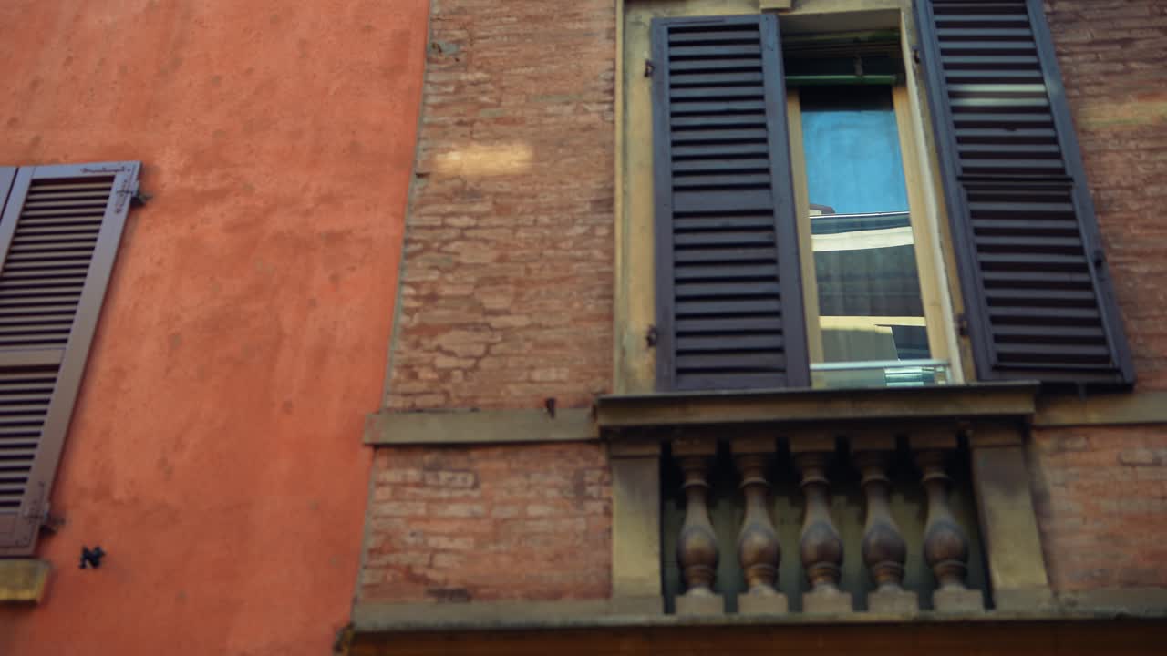 Italian Building Facade with Brown Shutters