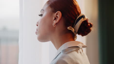 woman looking out window