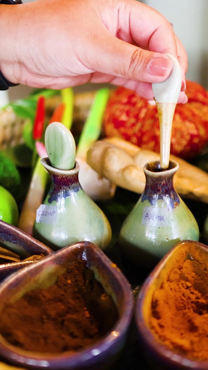 Hand preparing spa ingredients in Krabi, Thailand