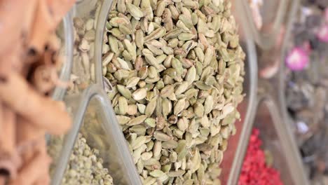 close-up of green cardamom pods in a spice market