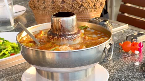 hot pot of thai soup with vegetables