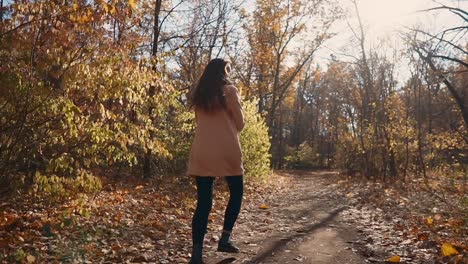 woman walking in an autumn forest