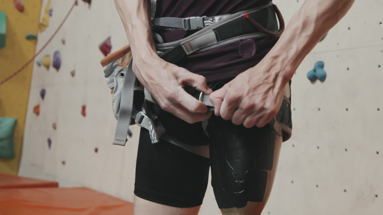 Man With Robotic Leg Wearing Equipment For Wall Climbing