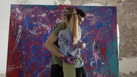 Couple-in-love-hugging-standing-in-front-large-canvas-all-in-paints