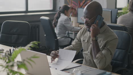 businessman talking on the phone in the office