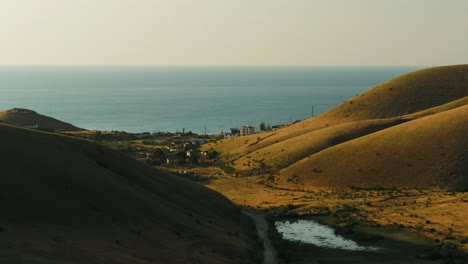 coastal hills and village scene