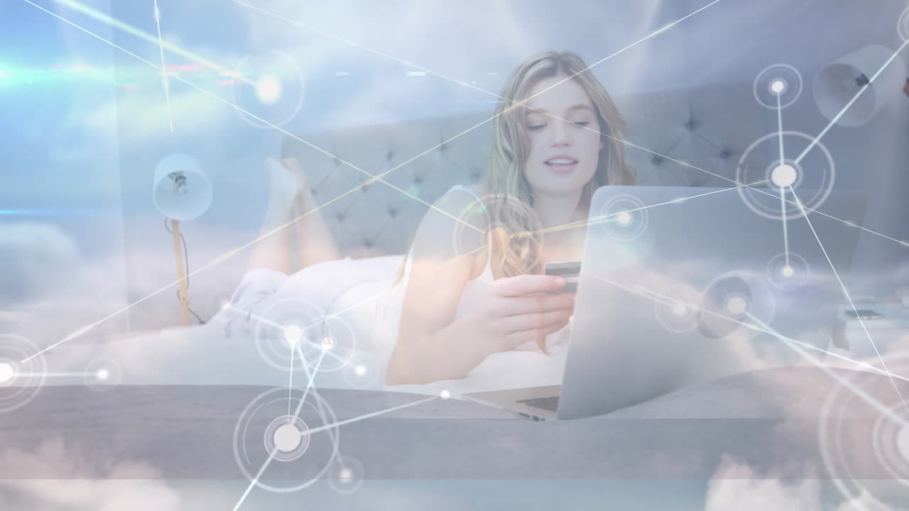 Animation of network of connections over female using laptop and clouds