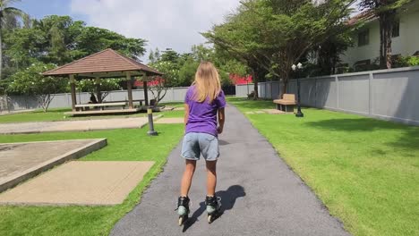 woman rollerblading in a park