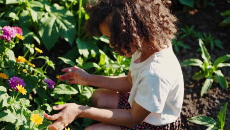 a young girl happily exploring a vibrant garden filled with flowers