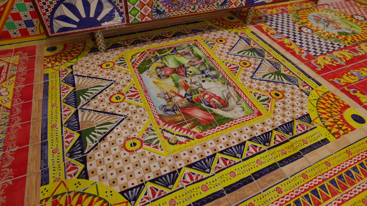 Bright and detailed mosaic tile artwork featuring various colorful patterns and intricate designs, showcasing a vibrant and artistic composition.