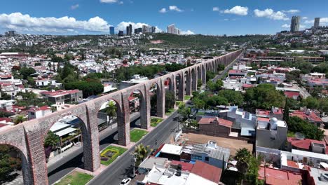 acueducto de queretaro in middle houses and buildings