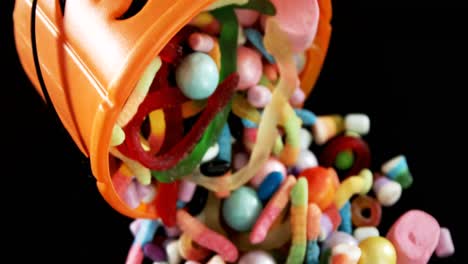 various confectioneries spilling out from halloween bucket 4k