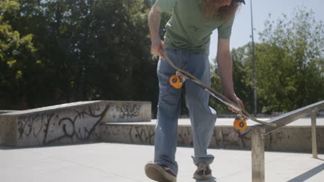 boy explaining a trick to his friend in skatepark.