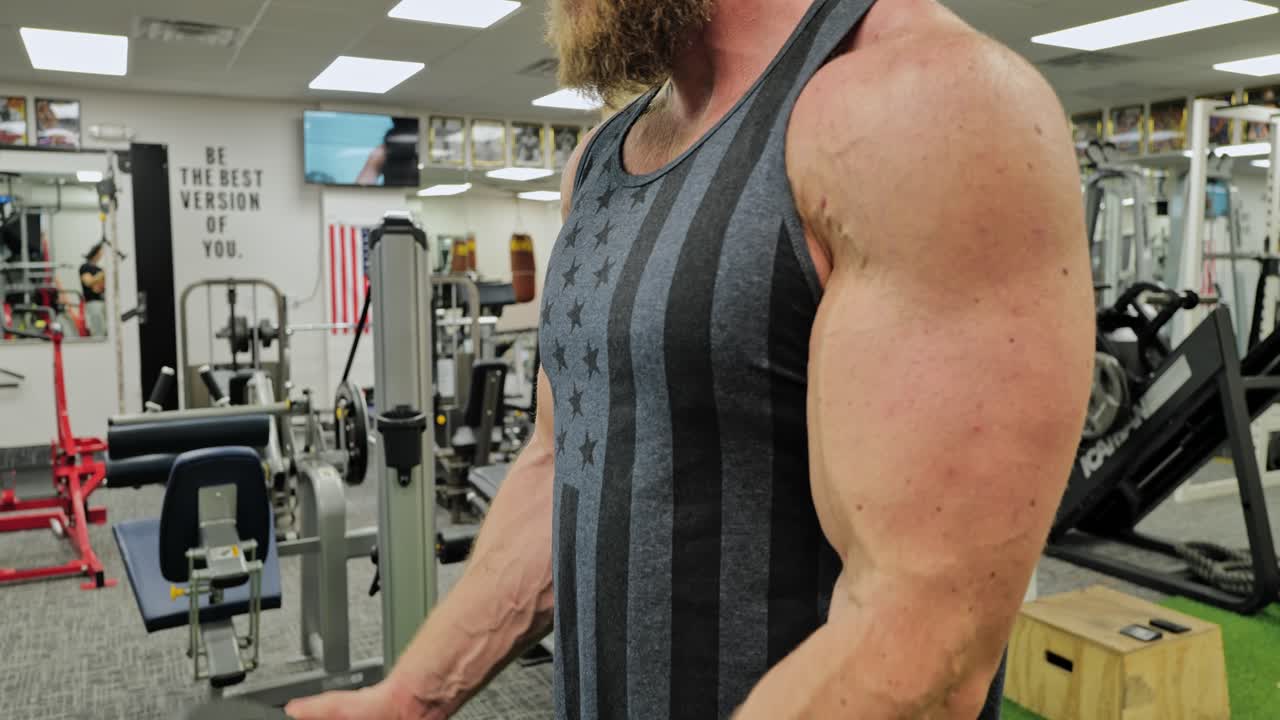 Strong bodybuilder strength workout in sport club