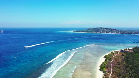 beautiful scenery of fiji island composed of green trees and white sand which surrounded by clear blue sea on a sunny day - aerial shot