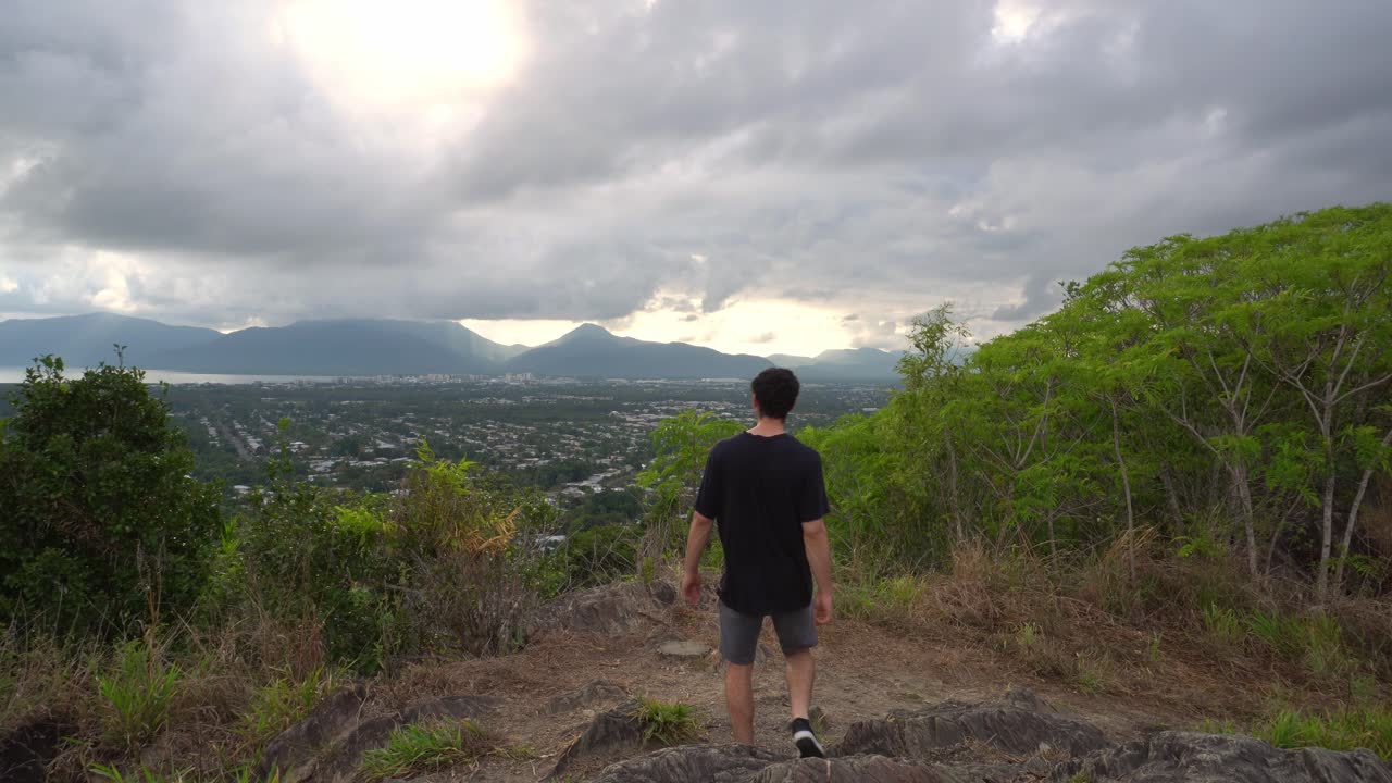 Man walking towards lookout and taking in the view.