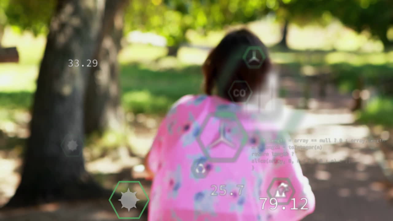 teenage girl walking along park path showing floating numeric tech overlays and JavaScript code