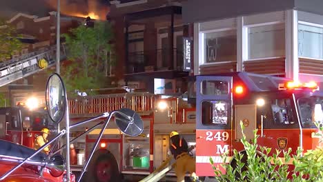 fire engine and burning private home building in canada, static view