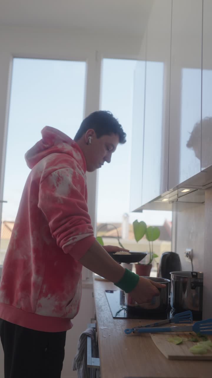 Teenage Boy Cooking in Kitchen