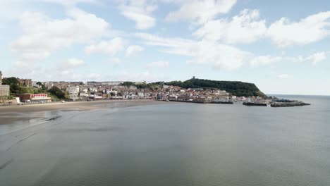 Aerial-bird's-eye-view-of-Scarborough-town,-beach,-harbour-and-castle