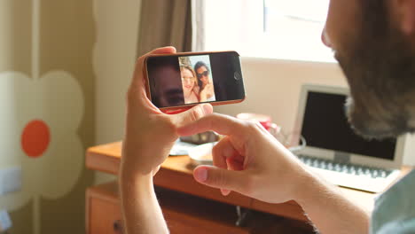 person looking at a photo of a beach on a smartphone