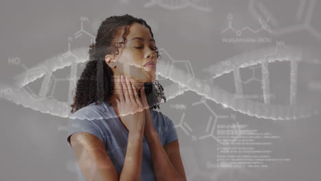 animation of dna strand diagrams with data processing over biracial woman holding neck