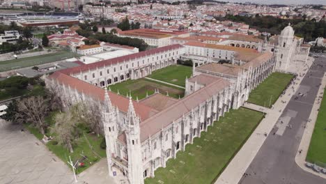 Jerónimos-Monastery-complex-an-iconic-landmark-in-Lisbon,-Aerial-Orbiting-shot