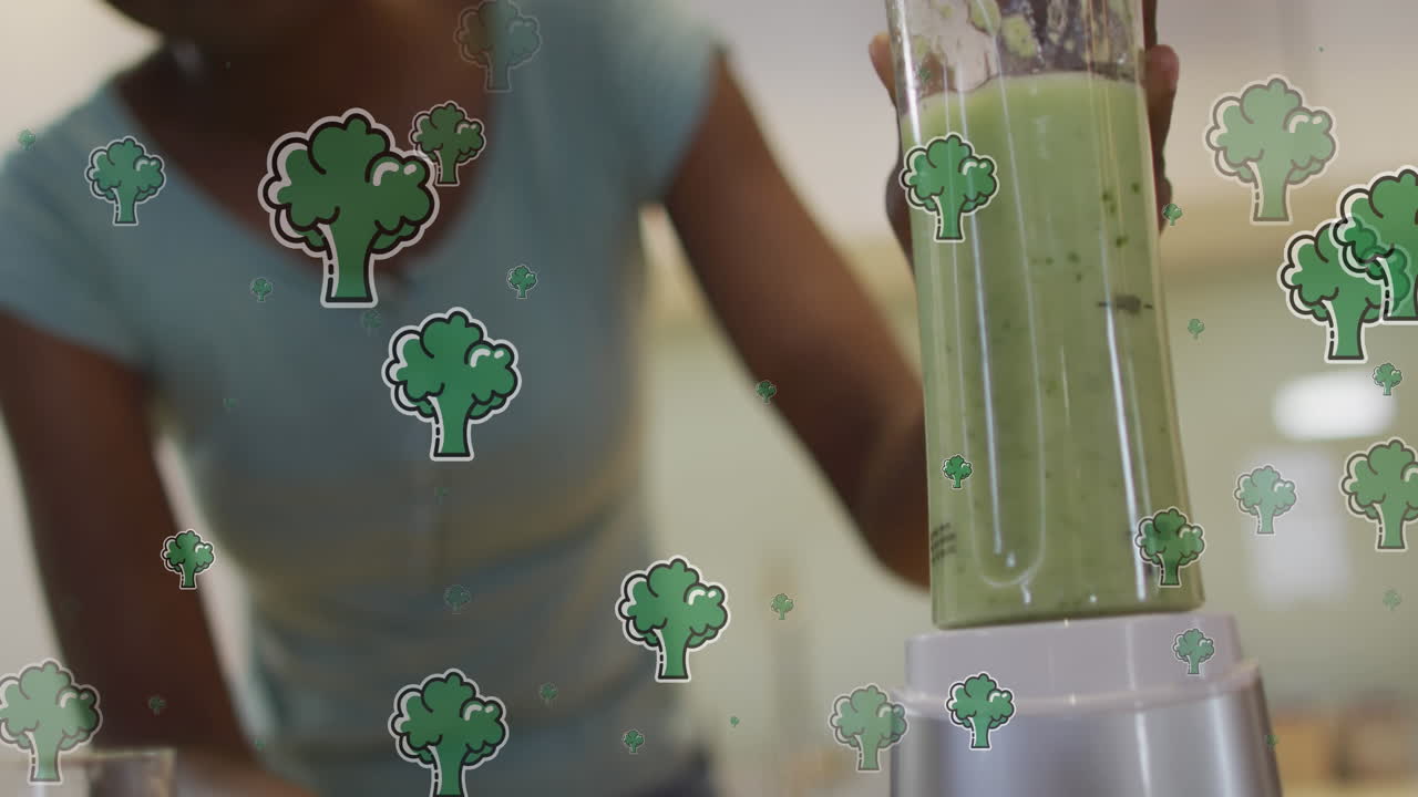animación de brócoli sobre una mujer afroamericana preparando un batido en la cocina